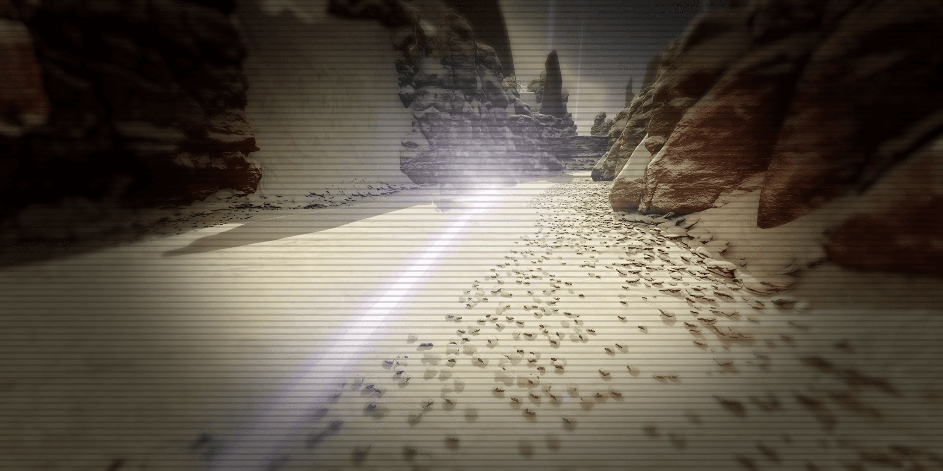A bright racing line curving through a sunlit rocky canyon.